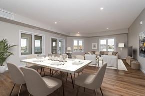 Brandon apartment for rent - A dining room with a table set for six with chairs around it.