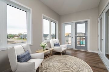 Brandon apartment for rent - A living room with a white couch and a rug.
