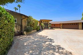 Los Angeles house for rent - A house with a driveway and a garage.