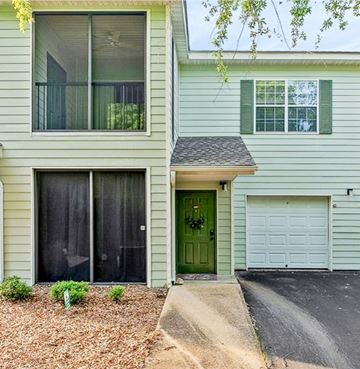 Auburn apartment for rent - A house with a green door and a garage door.