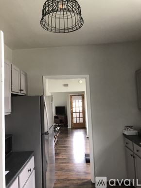 St. Joseph apartment for rent - A kitchen with a black fridge and a black counter top.