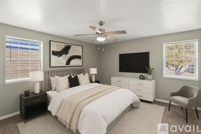 Fort Worth apartment for rent - A living room with a fireplace and a window with blinds.