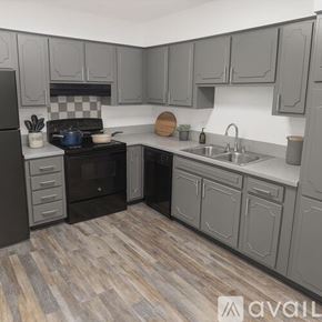 Fort Worth apartment for rent - A spacious room with wooden flooring and a large window with blinds.
