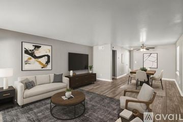 Fort Worth apartment for rent - A kitchen with black cabinets and a black fridge.