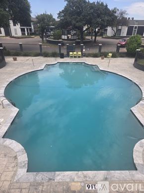 Fort Worth apartment for rent - A small pool with a stone edge and a stone border.