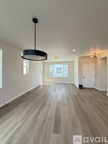 Colorado Springs house for rent - A kitchen with black cabinets and a countertop with a white paper towel on it.