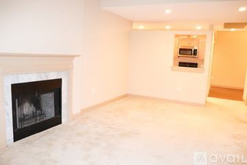 Braintree apartment for rent - A living room with a fireplace and a television on the wall.