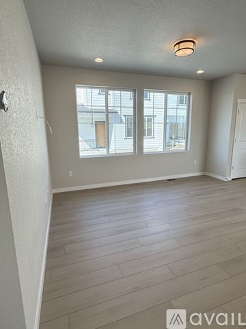 Colorado Springs house for rent - A kitchen with a window and tile flooring.