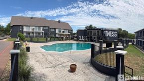 Fort Worth apartment for rent - A small pool with a stone edge and a stone border.