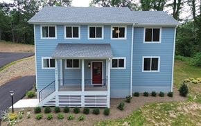Charlottesville house for rent - A blue house with a red door and a porch.