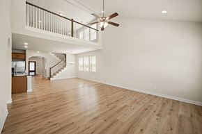 Richmond house for rent - A spacious room with a wooden floor and a ceiling fan.