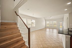 Richmond house for rent - A spacious living room with a staircase leading to the upper floor.