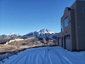 La Veta house for rent - A building with a snowy mountain in the background.