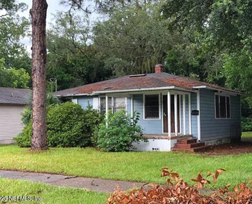 Jacksonville house for rent - A small blue house with a porch and a red roof.