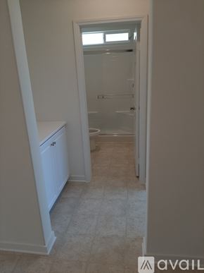 Riverside house for rent - A bathroom with a toilet and a walk-in shower.