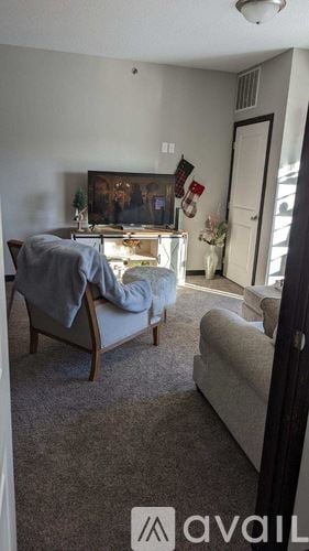 Mankato apartment for rent - A living room with a couch and a chair.