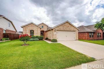 Fort Worth house for rent - A kitchen with wooden cabinets and a white island.