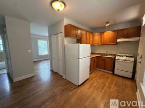 Chicago apartment for rent - A living room with a green couch, a red couch, and a coffee table.