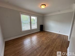 Chicago apartment for rent - A room with boxes on the floor and furniture.