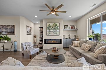 Richland house for rent - A living room with a fireplace and a painting on the wall.