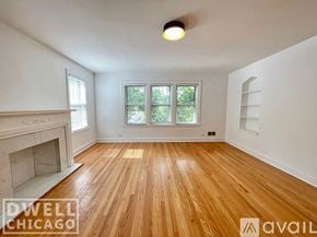 Chicago apartment for rent - A room with wooden flooring and a fireplace is available for rent.