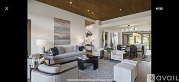 Heber City townhouse for rent - A living room with a grey sofa and a coffee table.