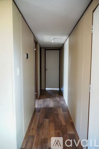 Pflugerville house for rent - A kitchen with wooden floors and a large island with a sink.