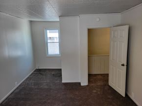 Glassport apartment for rent - A room with a window and a door.