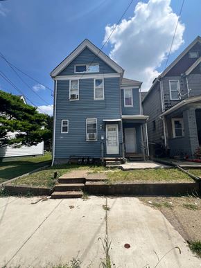 Glassport apartment for rent - A blue house with a white door and windows.