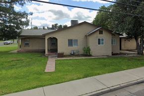 Merced house for rent - A house with a brown roof and a small front yard.