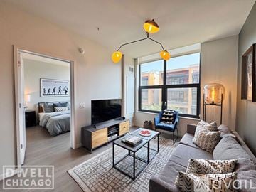 Chicago apartment for rent - A living room with a grey couch and a black coffee table.