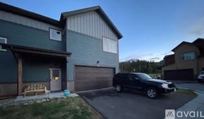 Silverthorne apartment for rent - A black SUV is parked in front of a house with a garage.