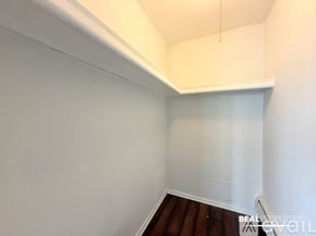 Chicago condo for rent - A view of a cityscape with a mix of modern and older buildings.