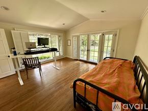 San Diego house for rent - A bedroom with a bed, desk, and chair.