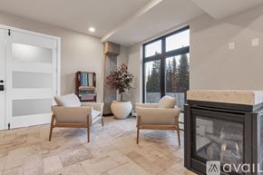 Winter Park apartment for rent - A living room with a fireplace and two chairs.