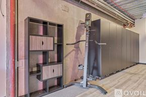 Winter Park apartment for rent - A gym with a squat rack and a wall-mounted pull up bar.