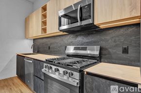 Scranton apartment for rent - A cityscape with buildings and a sunset in the background.