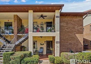 Deltona condo for rent - A QUILT image of a house with a pool and a living room.