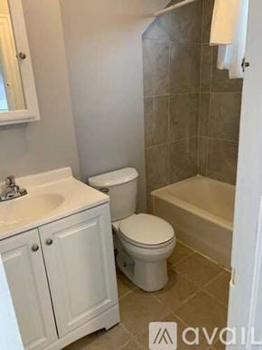 Albany apartment for rent - A bathroom with a toilet, sink, and bathtub.