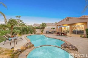 La Quinta house for rent - A house with a pool in the backyard.