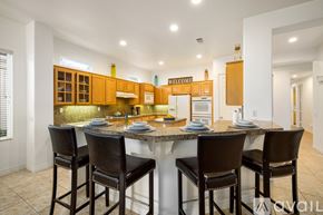 La Quinta house for rent - A kitchen with a table and chairs in front of it.