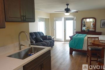 Menifee apartment for rent - A kitchen with a sink and a ceiling fan.