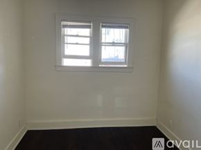 Los Angeles apartment for rent - A room with a window and a sign that says "AVAIL".