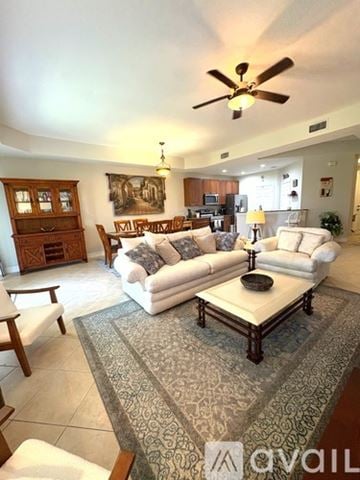 Fort Myers townhouse for rent - A living room with a white couch and a rug.