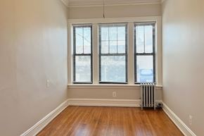 Oak Park apartment for rent - A room with a window and a radiator on the floor.