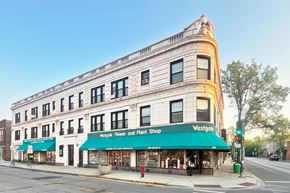 Oak Park apartment for rent - A street view of a building with a green awning that says "Vergil's Flower and Plant Shop".