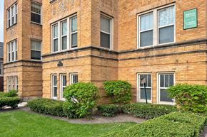 Oak Park apartment for rent - A brick building with a green sign that says "Dairy Queen.".