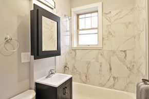 Oak Park apartment for rent - a bathroom with a sink and a bath tub and a window