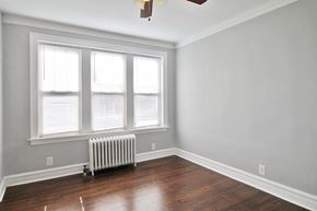 Oak Park apartment for rent - an empty room with a radiator and three windows