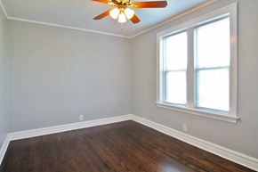 Oak Park apartment for rent - an empty room with a ceiling fan and two windows